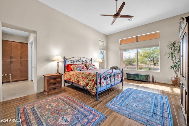 bedroom featuring light hardwood / wood-style flooring and ceiling fan