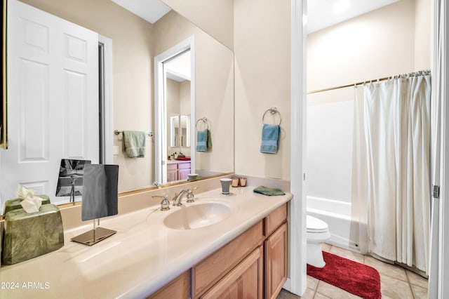 full bathroom featuring tile patterned floors, shower / bathtub combination with curtain, vanity, and toilet