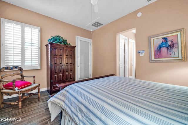 bedroom featuring ceiling fan and dark wood-type flooring