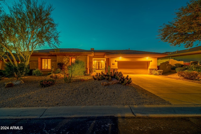 view of front of property with a garage