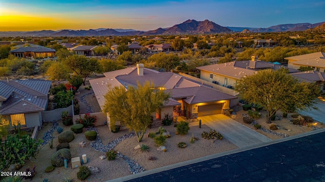 aerial view at dusk with a mountain view