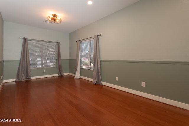 unfurnished room featuring hardwood / wood-style flooring