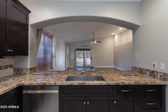 kitchen with sink, light stone counters, stainless steel dishwasher, tasteful backsplash, and ceiling fan