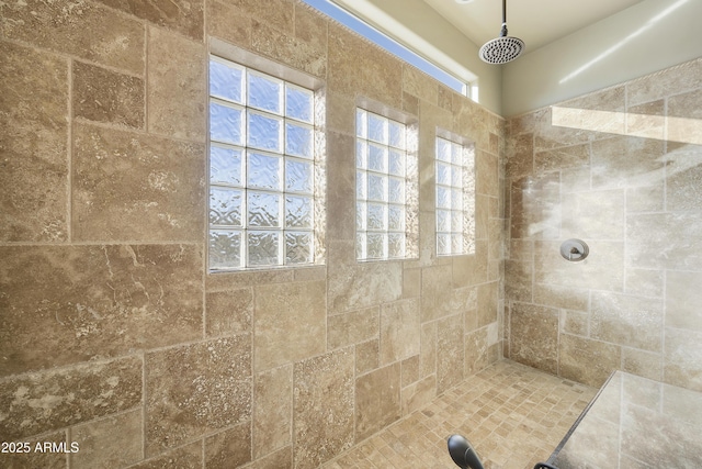 bathroom featuring tiled shower