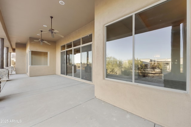 view of patio / terrace featuring ceiling fan