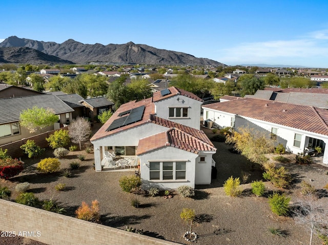 drone / aerial view featuring a mountain view and a residential view