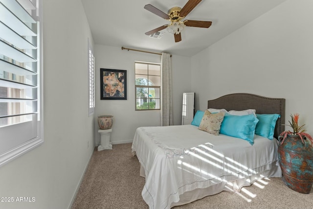 20701 W Minnezona Ave, Buckeye, AZ 85396 - bedroom with light carpet, visible vents, a ceiling fan, and baseboards