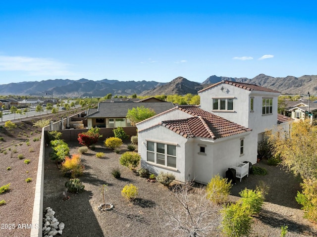 20701 W Minnezona Ave, Buckeye, AZ 85396 - exterior space featuring stucco siding, a mountain view, a tile roof, and fence