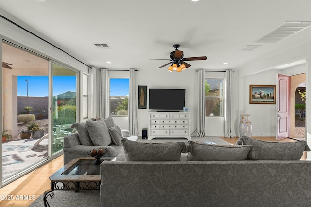 20701 W Minnezona Ave, Buckeye, AZ 85396 - living room with visible vents, recessed lighting, a ceiling fan, and wood finished floors