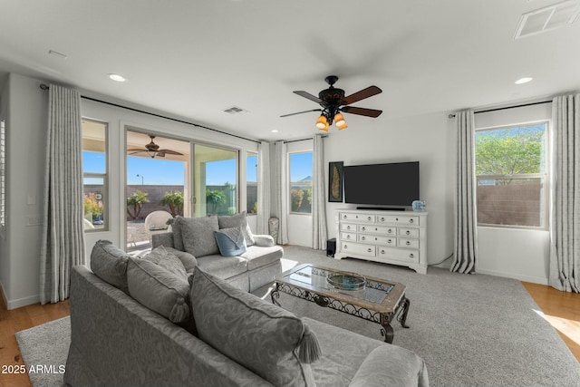 20701 W Minnezona Ave, Buckeye, AZ 85396 - living area with a ceiling fan, recessed lighting, wood finished floors, and visible vents