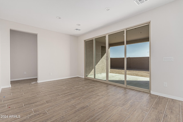 unfurnished room featuring light hardwood / wood-style flooring