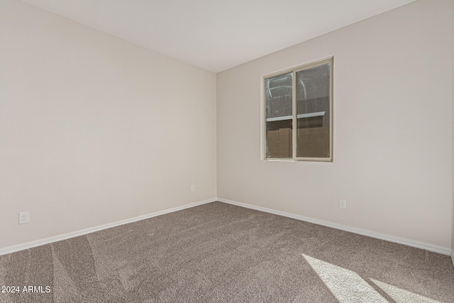 unfurnished room featuring carpet flooring