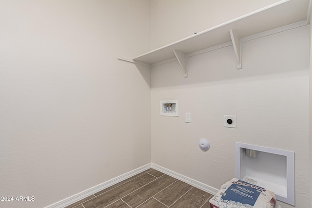 washroom featuring hookup for an electric dryer, gas dryer hookup, dark hardwood / wood-style floors, and washer hookup