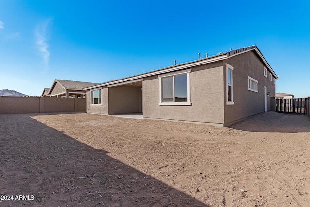 rear view of property with a patio area