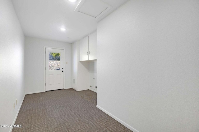 laundry room with cabinet space, attic access, baseboards, and carpet flooring