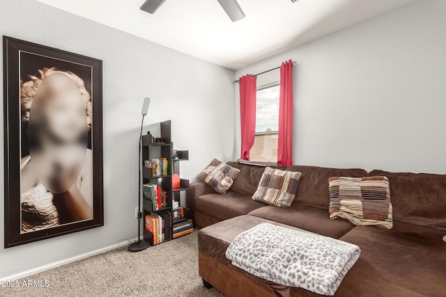 living room with ceiling fan, carpet flooring, and baseboards
