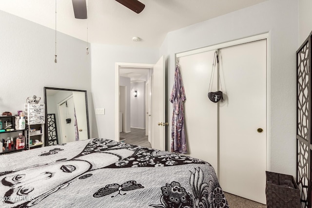bedroom featuring a closet, a ceiling fan, and carpet