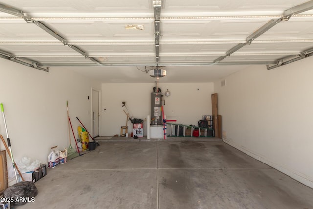 garage featuring a garage door opener and water heater