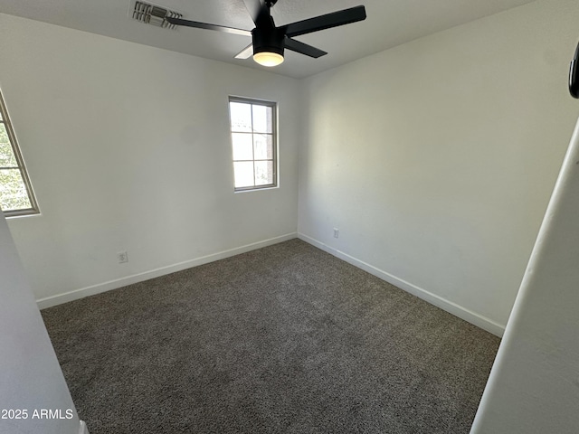 carpeted empty room featuring ceiling fan and plenty of natural light