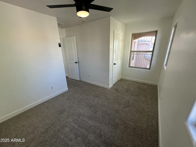 carpeted empty room featuring ceiling fan