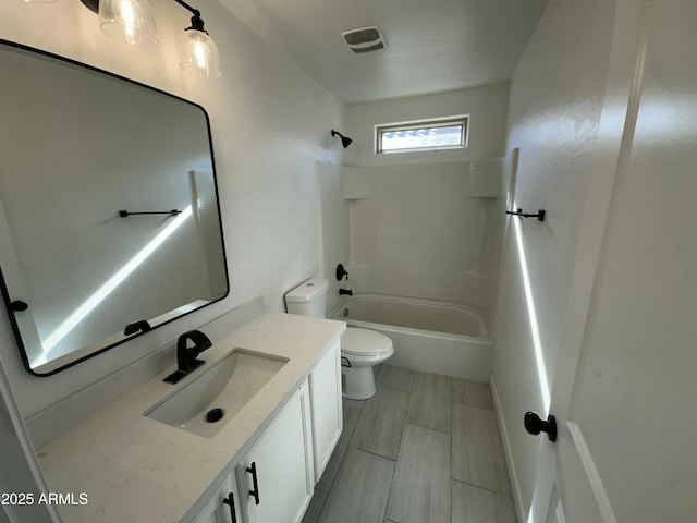 full bathroom with shower / tub combination, vanity, and toilet