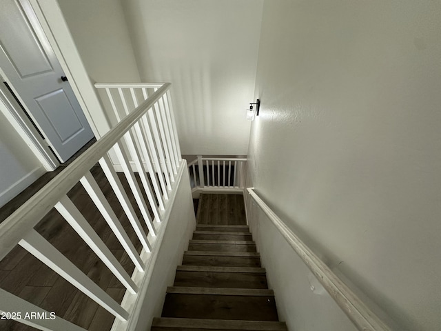 staircase featuring hardwood / wood-style floors