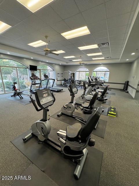 exercise room with visible vents and a drop ceiling