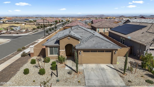 16430 W Alameda Rd, Surprise, AZ 85387 - view of front of house with a garage, a residential view, concrete driveway, and stucco siding