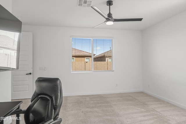 office area featuring a ceiling fan, carpet, visible vents, and baseboards