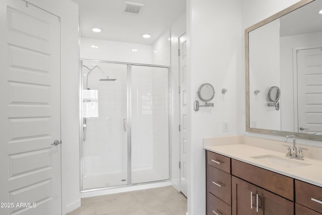 full bath with recessed lighting, visible vents, a stall shower, vanity, and tile patterned flooring