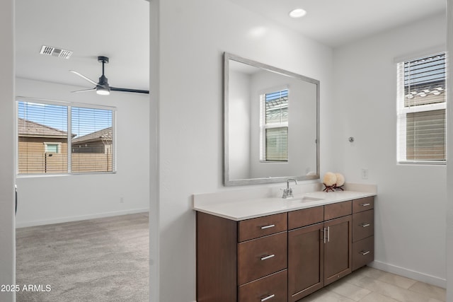 bathroom with recessed lighting, visible vents, ceiling fan, vanity, and baseboards