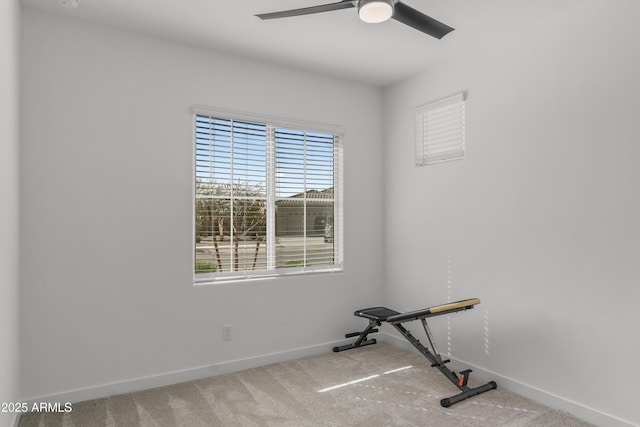 exercise area with ceiling fan, carpet floors, and baseboards