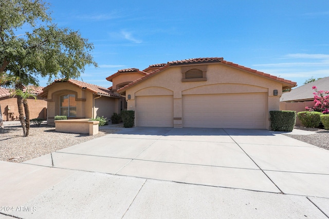 mediterranean / spanish-style house featuring a garage