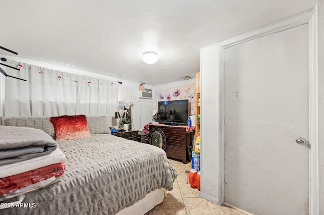 bedroom with visible vents and tile patterned flooring