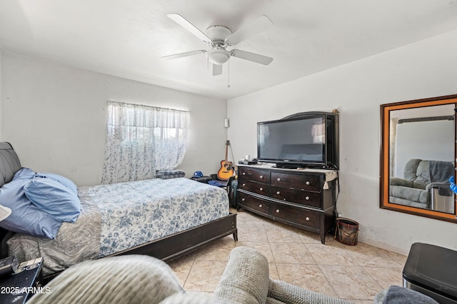 bedroom featuring light tile patterned floors and a ceiling fan