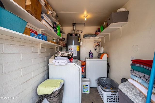 interior space with washer and clothes dryer and gas water heater