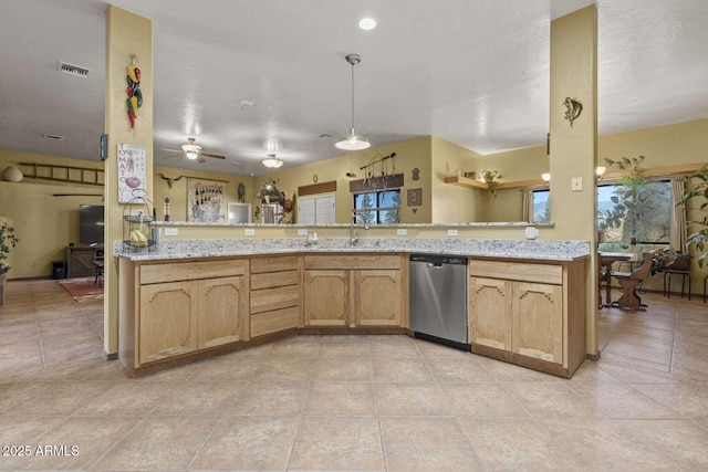 kitchen with visible vents, light tile patterned flooring, a sink, dishwasher, and a peninsula