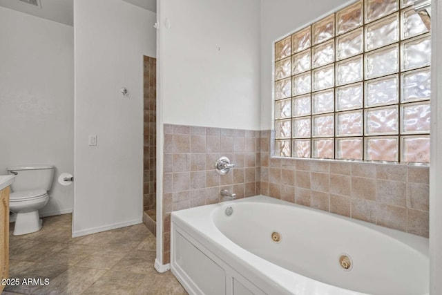 full bath with a tub with jets, visible vents, toilet, baseboards, and tile patterned floors