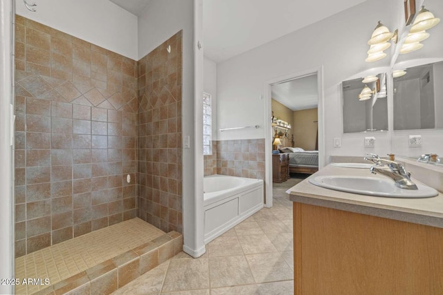 full bath with double vanity, a sink, ensuite bath, tile patterned flooring, and a bath