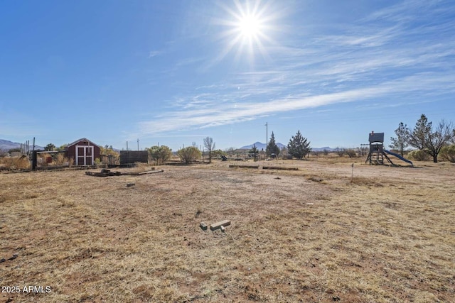 view of yard featuring a playground and a rural view