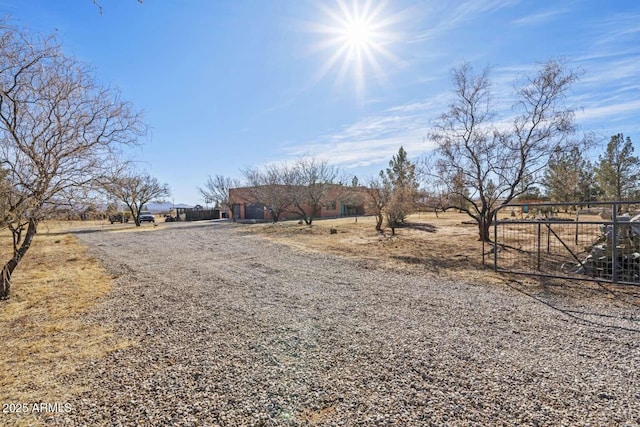 view of street featuring driveway and a rural view