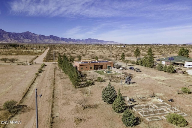 drone / aerial view featuring a rural view and a mountain view