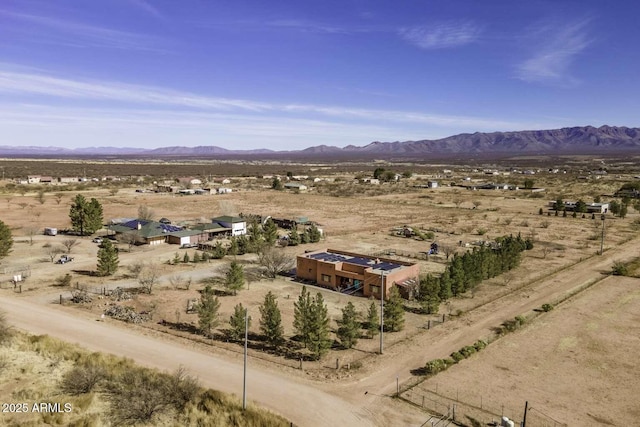 mountain view with view of desert and a rural view