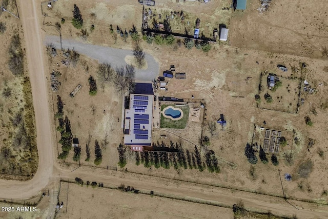 birds eye view of property featuring a rural view