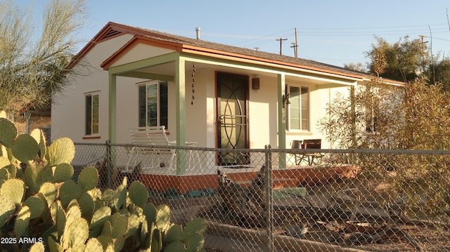 view of side of home with a porch