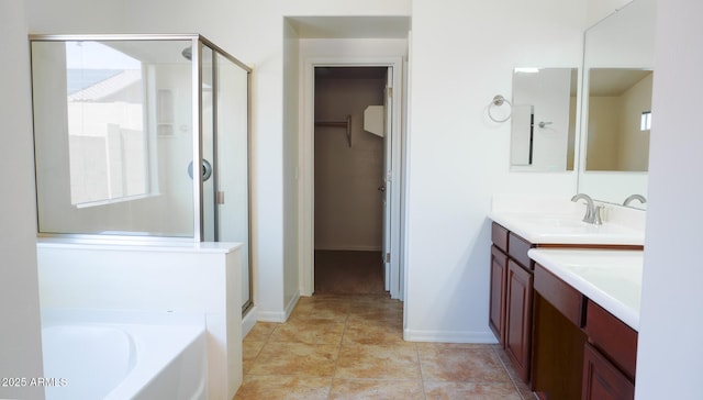 full bathroom with a stall shower, tile patterned floors, vanity, and a bath