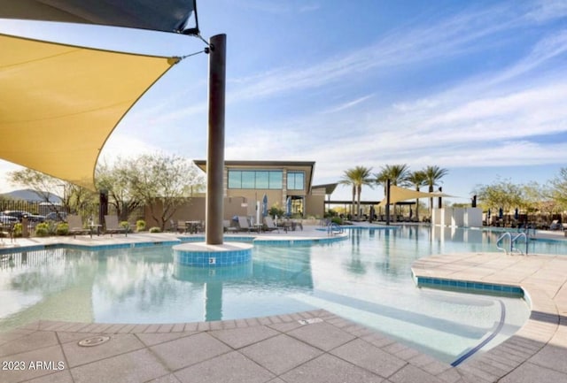 view of swimming pool with a patio area