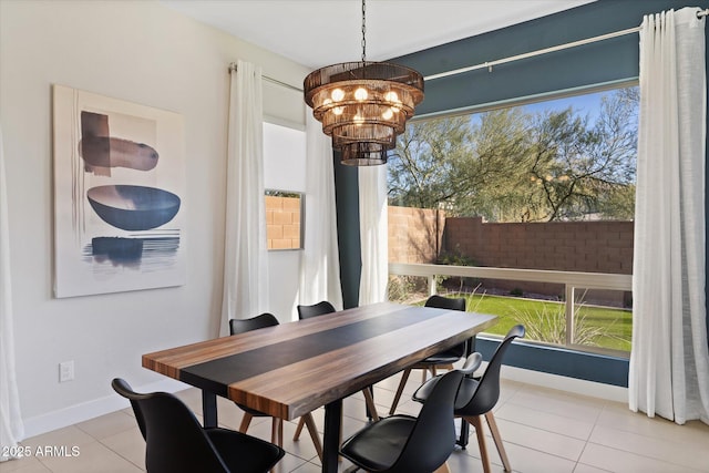 dining room featuring light tile patterned floors and a chandelier