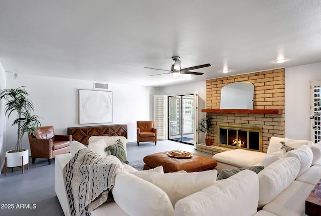 1106 N Villa Nueva Dr, Litchfield Park, AZ 85340 - living room with ceiling fan and a fireplace