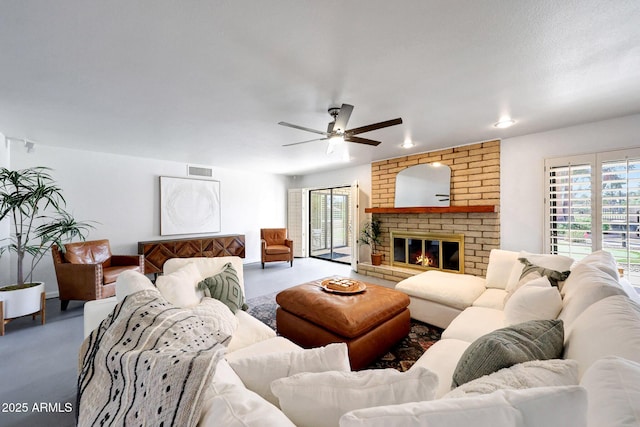 1106 N Villa Nueva Dr, Litchfield Park, AZ 85340 - living room with a ceiling fan and a brick fireplace
